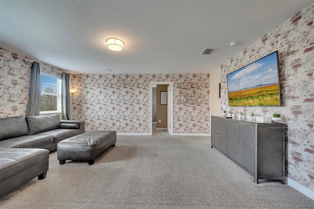 unfurnished living room with a textured ceiling and light colored carpet