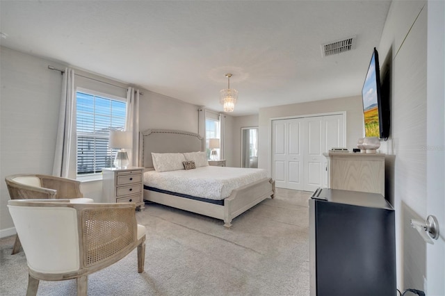 1536 Maidstone Ct, Davenport, FL 33896 - bedroom with light colored carpet, visible vents, and a closet