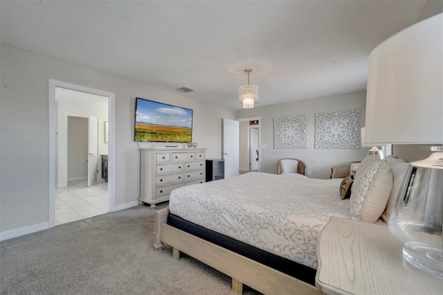 carpeted bedroom featuring connected bathroom