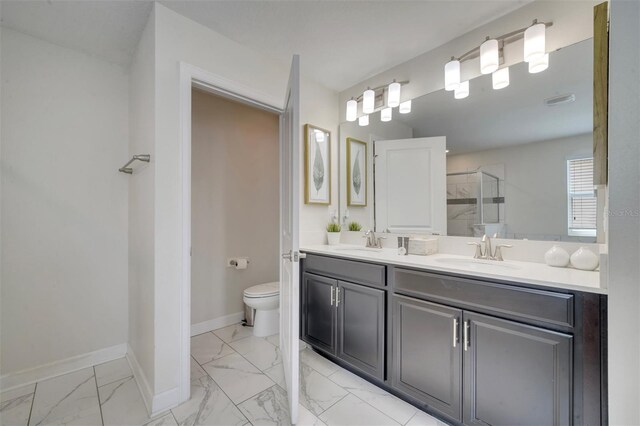 1536 Maidstone Ct, Davenport, FL 33896 - full bath with marble finish floor, a sink, a stall shower, and baseboards