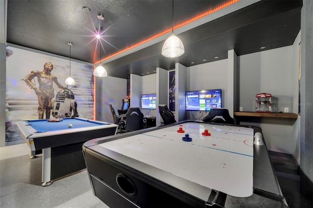 recreation room with pool table and a textured ceiling