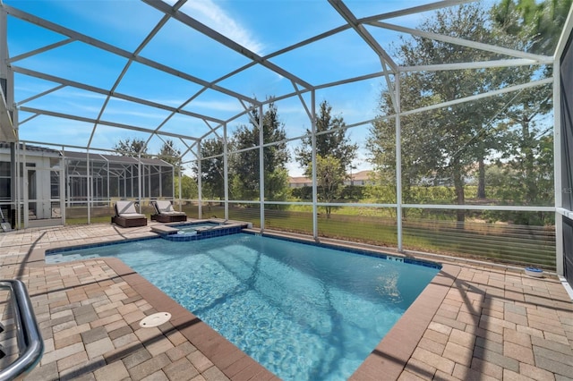 view of swimming pool with a lanai, a patio, and an in ground hot tub