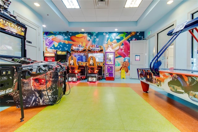 1536 Maidstone Ct, Davenport, FL 33896 - playroom with tile patterned floors, visible vents, a tray ceiling, and a paneled ceiling