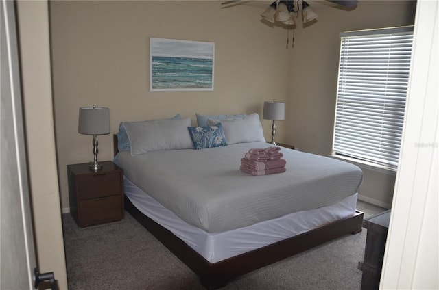 bedroom with ceiling fan and carpet