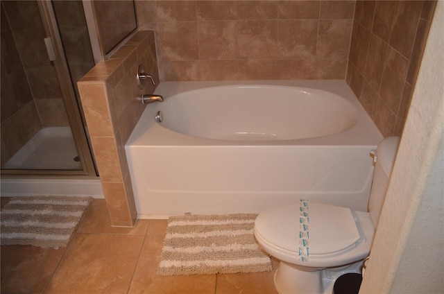 bathroom with tile patterned flooring, toilet, and plus walk in shower