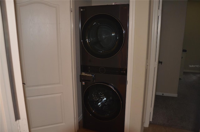 washroom with stacked washer and clothes dryer