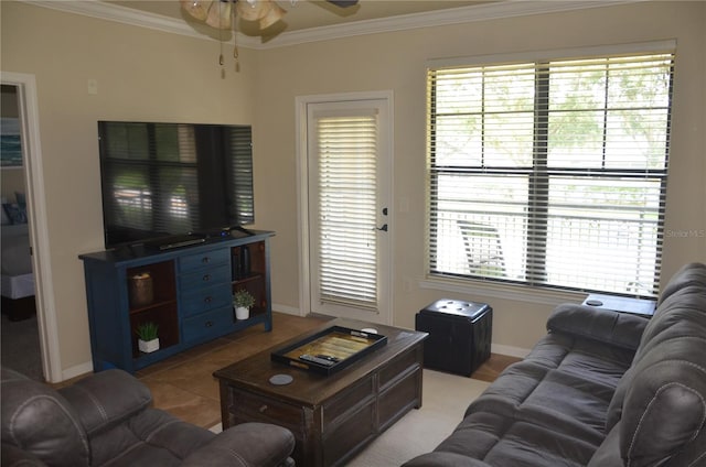 living room featuring ceiling fan, light tile patterned flooring, and ornamental molding