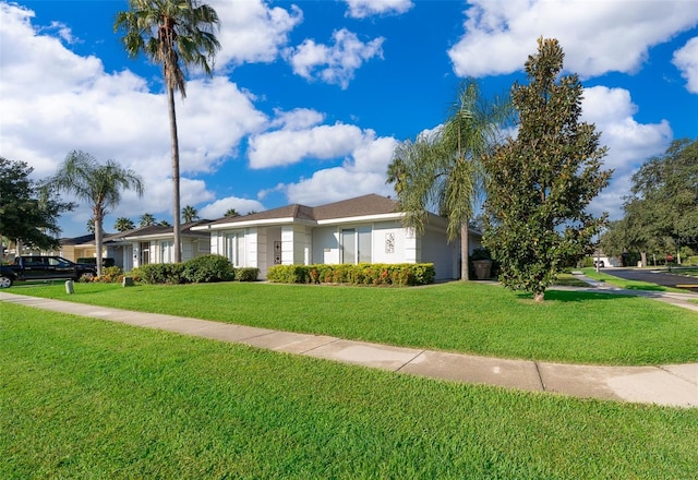 view of front of property with a front lawn