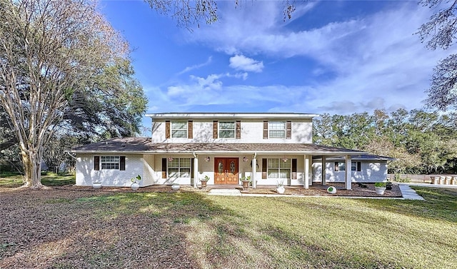 view of front of house featuring a front yard and a porch