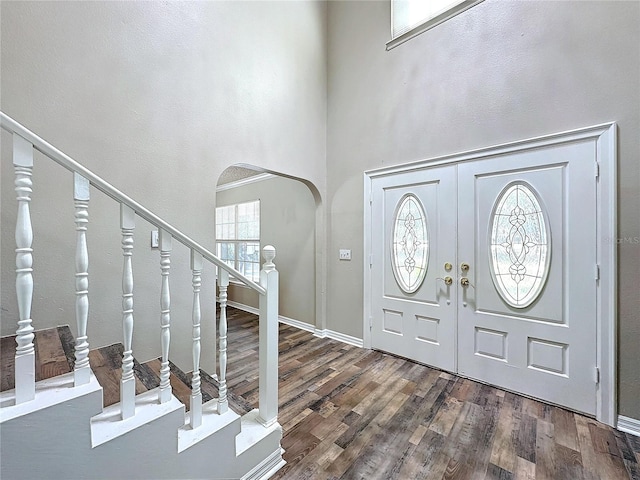 foyer entrance with dark hardwood / wood-style flooring