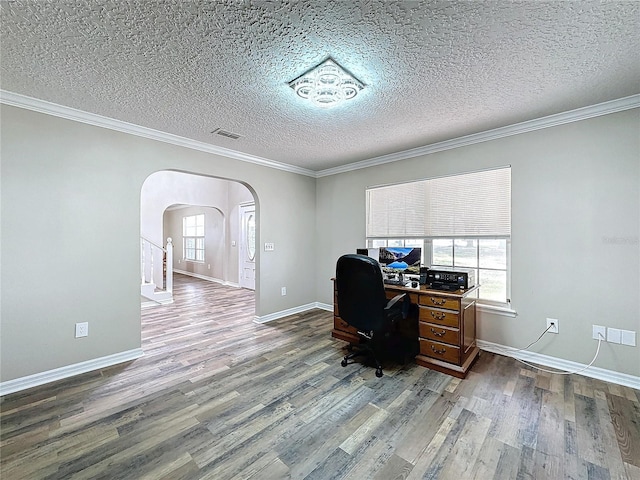 office with a textured ceiling, ornamental molding, and hardwood / wood-style flooring