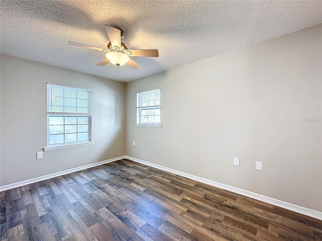 unfurnished room with ceiling fan, a textured ceiling, and dark hardwood / wood-style flooring