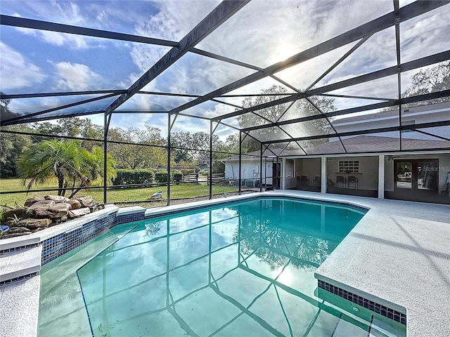 view of pool with a lanai and a patio area