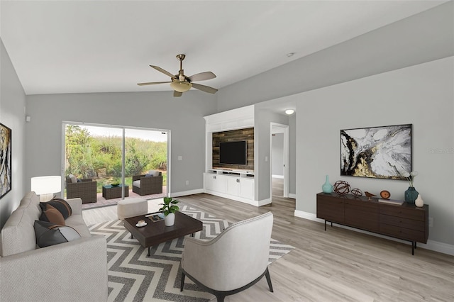 living room featuring light hardwood / wood-style flooring, lofted ceiling, and ceiling fan