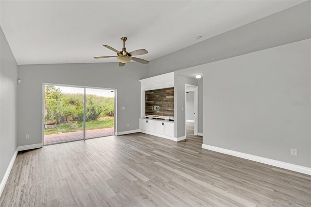 unfurnished living room with ceiling fan, light wood-type flooring, and lofted ceiling