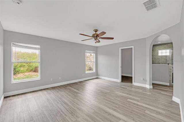 empty room featuring ceiling fan and light wood-type flooring