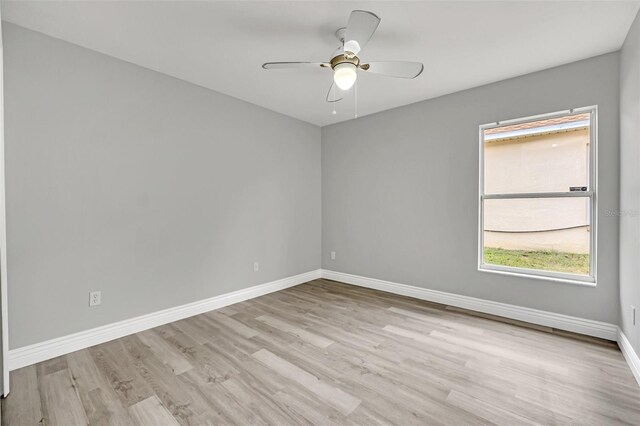 unfurnished room with ceiling fan and light wood-type flooring