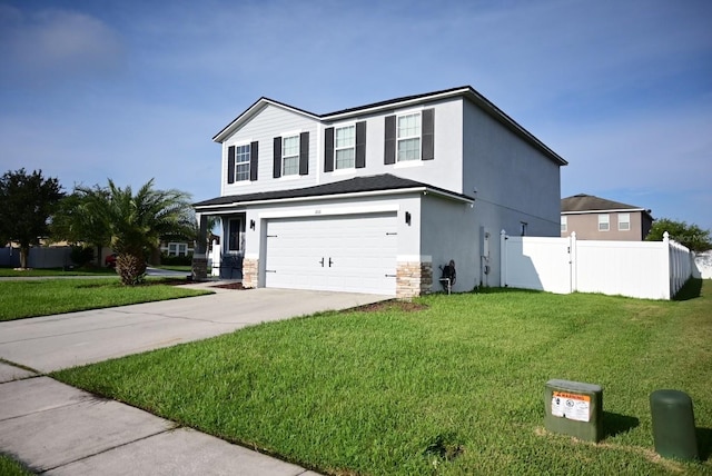 view of front of house with a garage and a front lawn