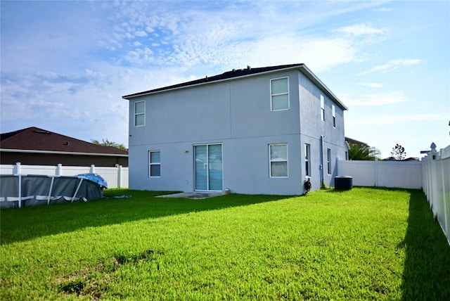 rear view of house with a lawn