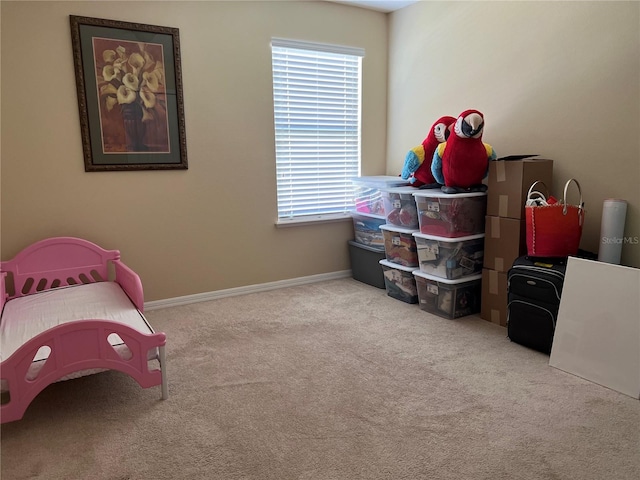 bedroom featuring light carpet