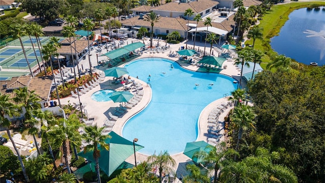 birds eye view of property with a water view