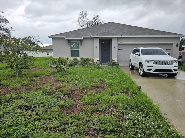 ranch-style house featuring a garage