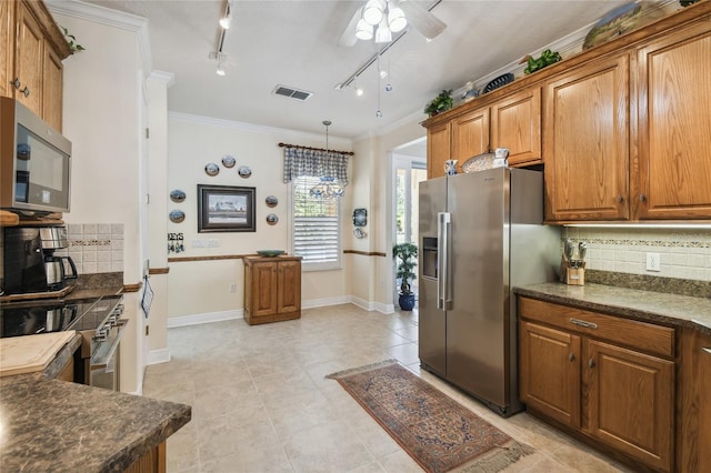 kitchen with decorative backsplash, stainless steel appliances, ceiling fan, and ornamental molding