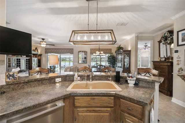 kitchen featuring sink, ceiling fan with notable chandelier, light tile patterned floors, crown molding, and stainless steel dishwasher