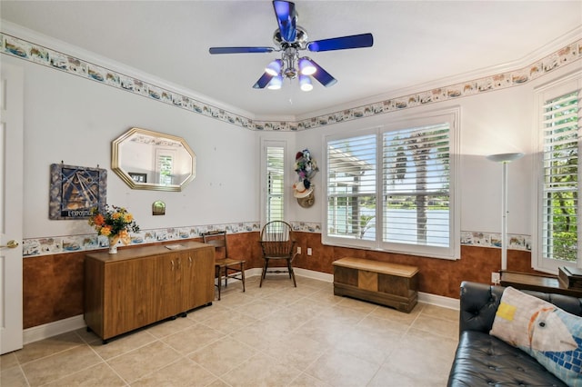 tiled office space with ornamental molding, ceiling fan, and a healthy amount of sunlight