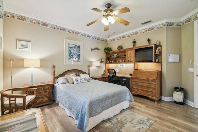 bedroom featuring ceiling fan, light wood-type flooring, and ornamental molding