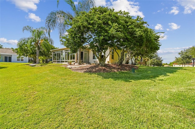 view of yard with a sunroom