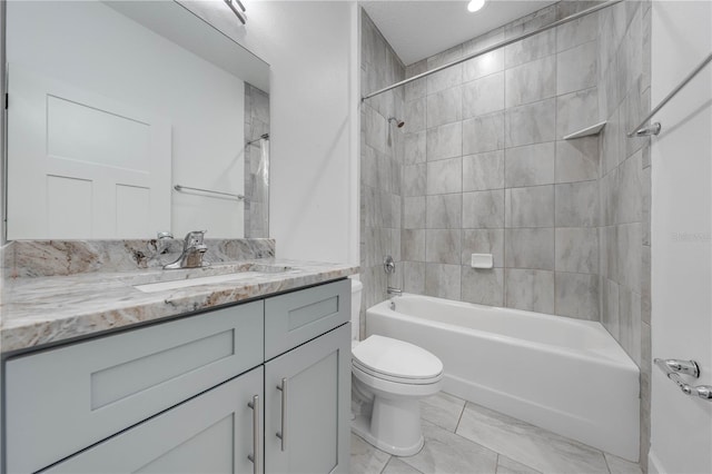 bathroom with vanity, toilet, and washtub / shower combination