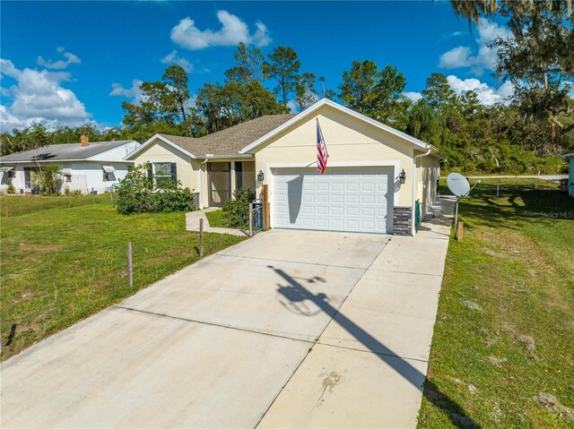 2909 Annalee Rd, Saint Cloud, FL 34771 - single story home with an attached garage, a front yard, concrete driveway, and stucco siding