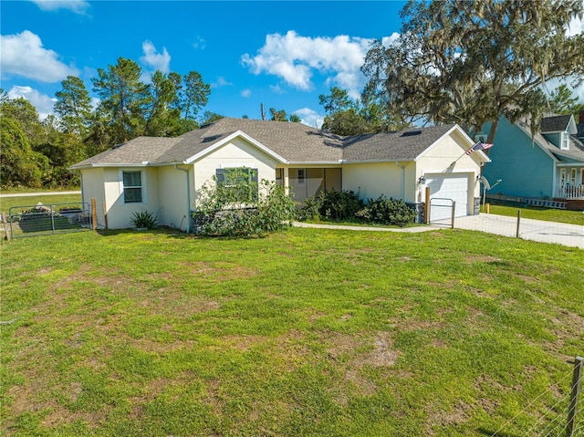 ranch-style home with fence, a front yard, stucco siding, driveway, and an attached garage