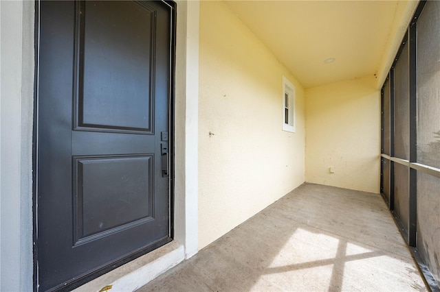 view of exterior entry with stucco siding