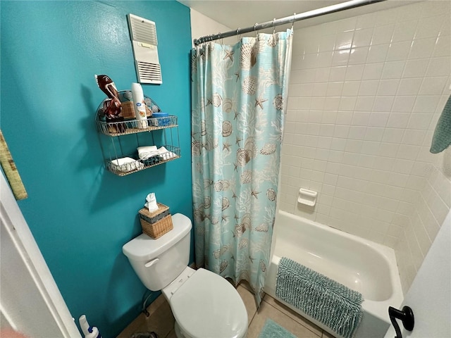 bathroom with tile patterned floors, toilet, and shower / bath combo