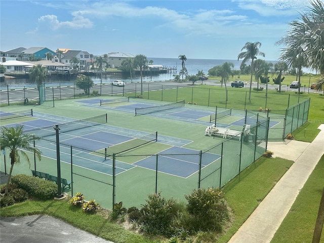 view of sport court with a water view