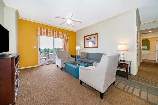 carpeted living room with ornamental molding and ceiling fan