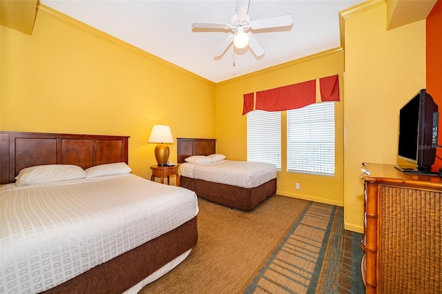 bedroom with ceiling fan, crown molding, and dark colored carpet