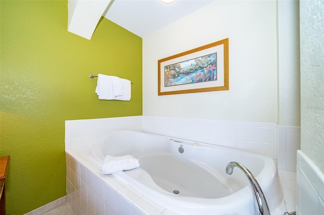 bathroom featuring a relaxing tiled tub