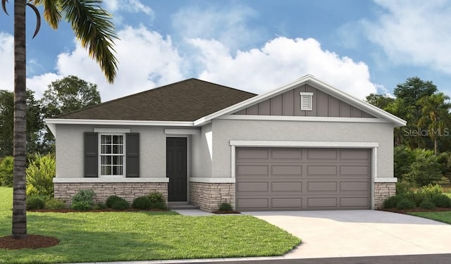 view of front of home with a front yard and a garage