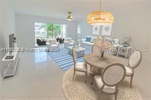 dining space featuring ceiling fan and tile patterned floors