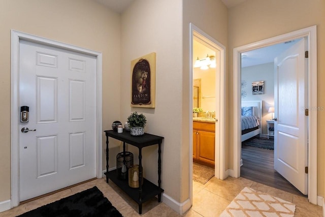 foyer entrance featuring light tile patterned floors