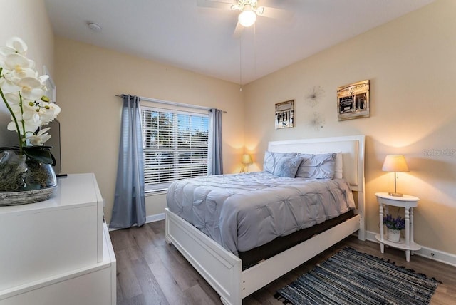 bedroom featuring dark hardwood / wood-style floors and ceiling fan