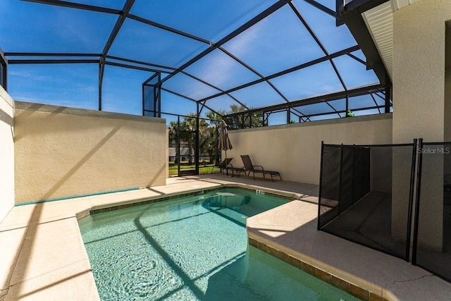 view of pool with a lanai and a patio area