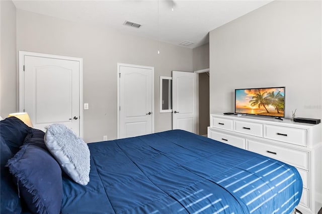 bedroom featuring visible vents