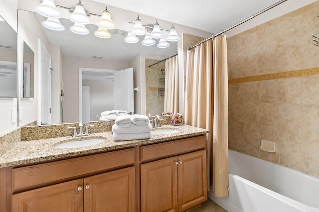 full bathroom featuring shower / bath combination with curtain, double vanity, a sink, and visible vents