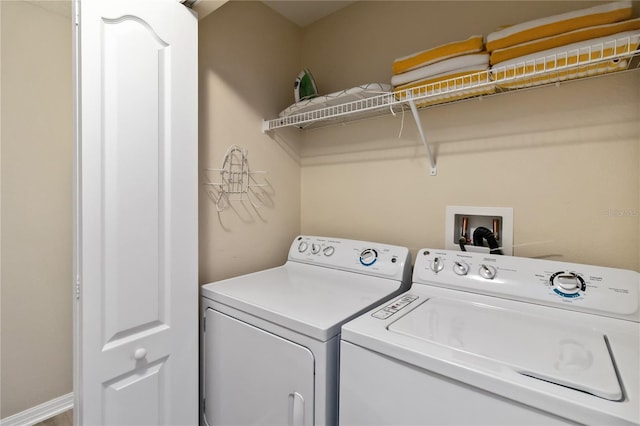 washroom featuring laundry area and separate washer and dryer