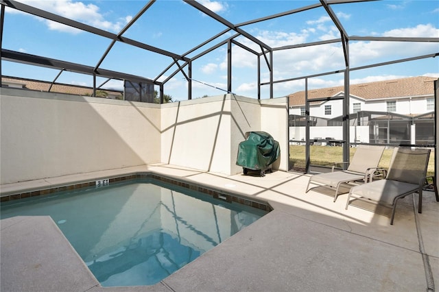 pool with a patio area and a lanai