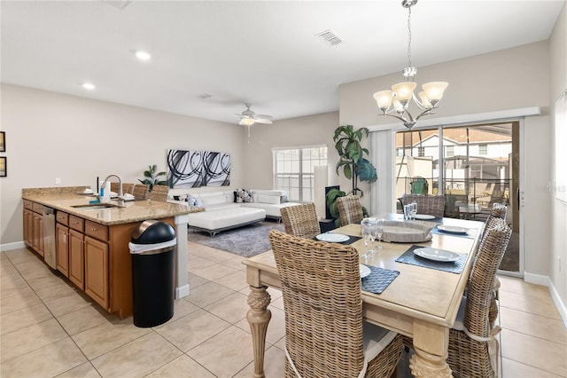 dining area with light tile patterned floors, recessed lighting, visible vents, baseboards, and ceiling fan with notable chandelier